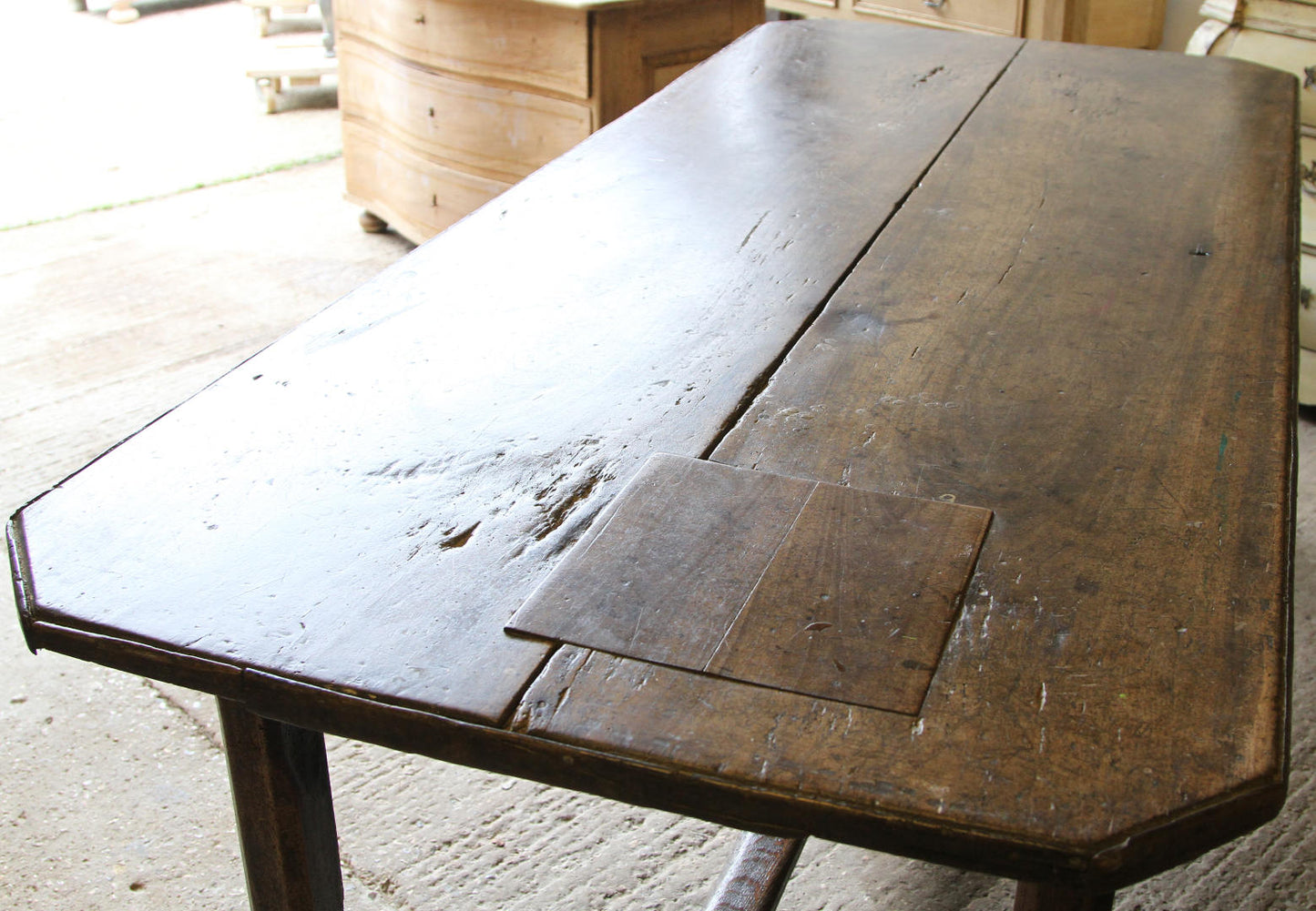 An aerial view of the walnut table showing the patina