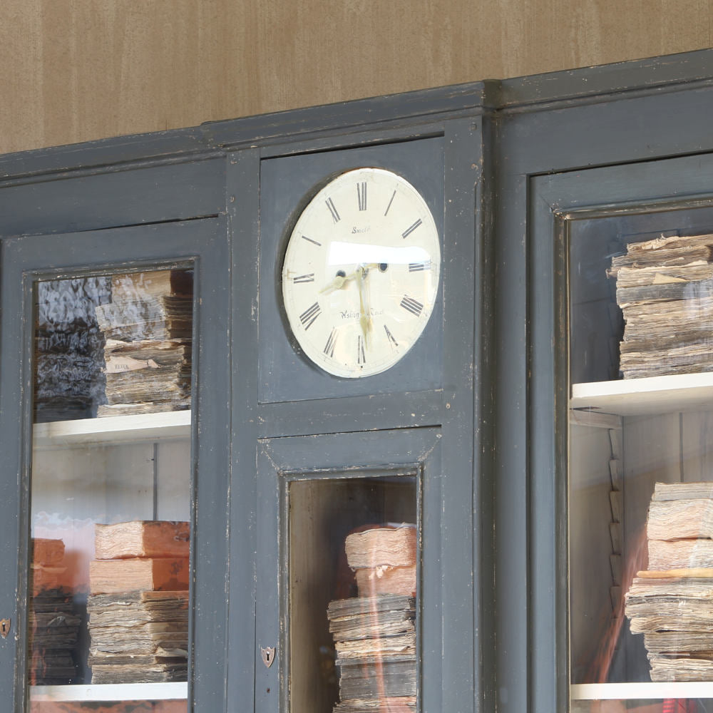 Housekeepers cupboard with clock