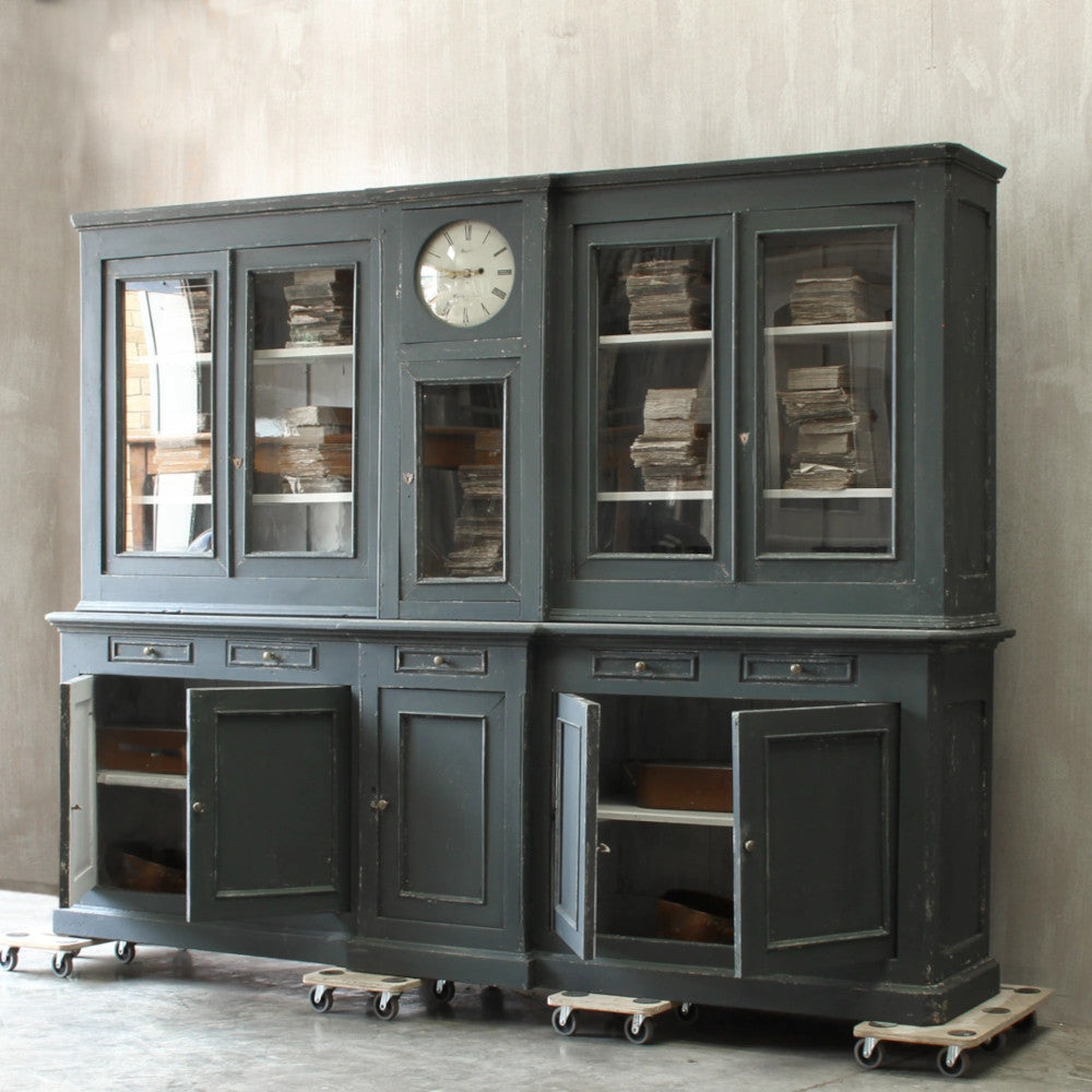 Housekeepers cupboard with clock